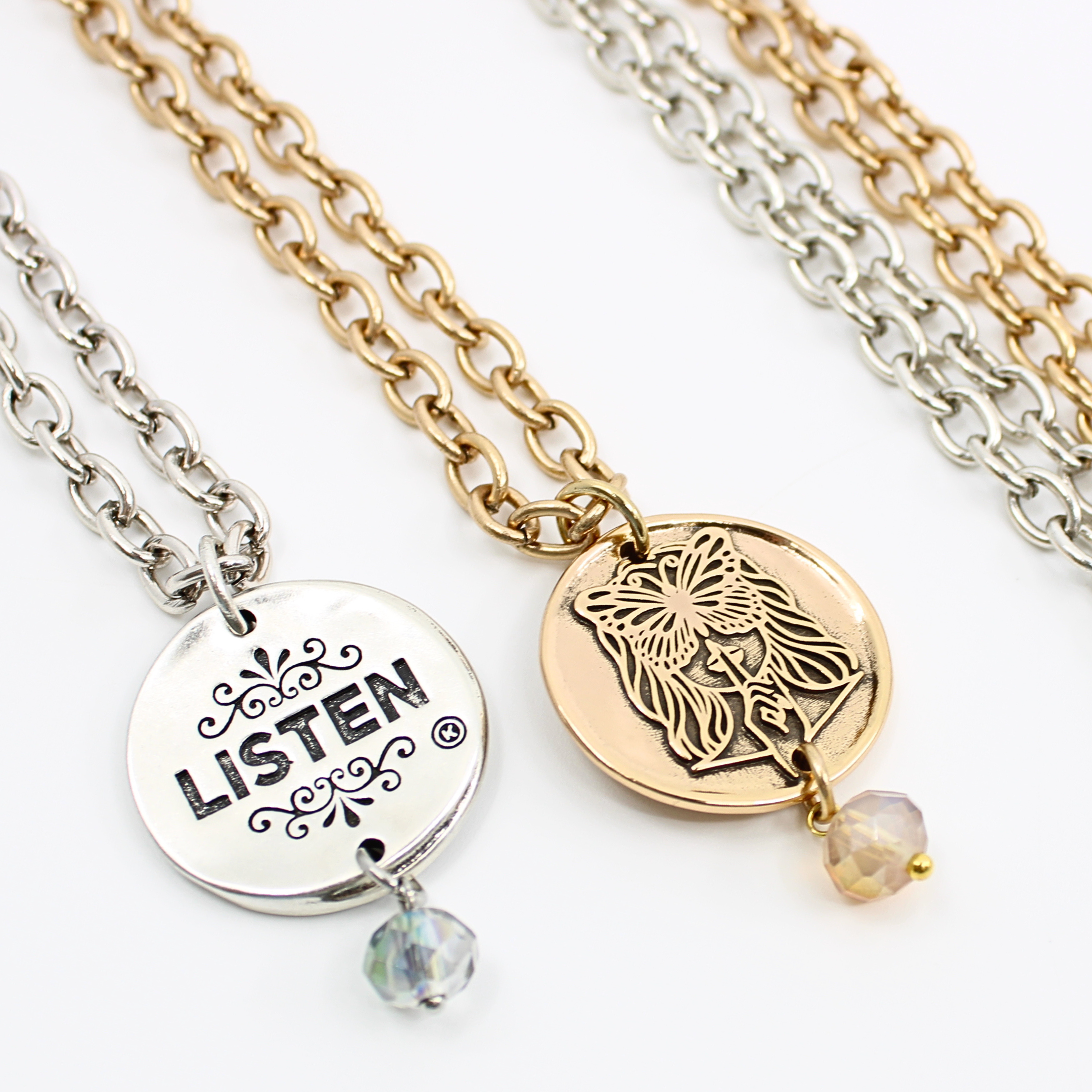Katia Designs Listen Madame Butterfly Essential Necklace in antique gold featuring a delicate butterfly pendant and chain detail