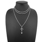 Katia Designs antique gold Love Fleur-de-Lis essential necklace with intricate fleur-de-lis pendant and delicate chain.