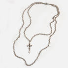 Katia Designs Love Fleur-de-Lis essential necklace in antique gold, featuring a detailed fleur-de-lis pendant on a chain.