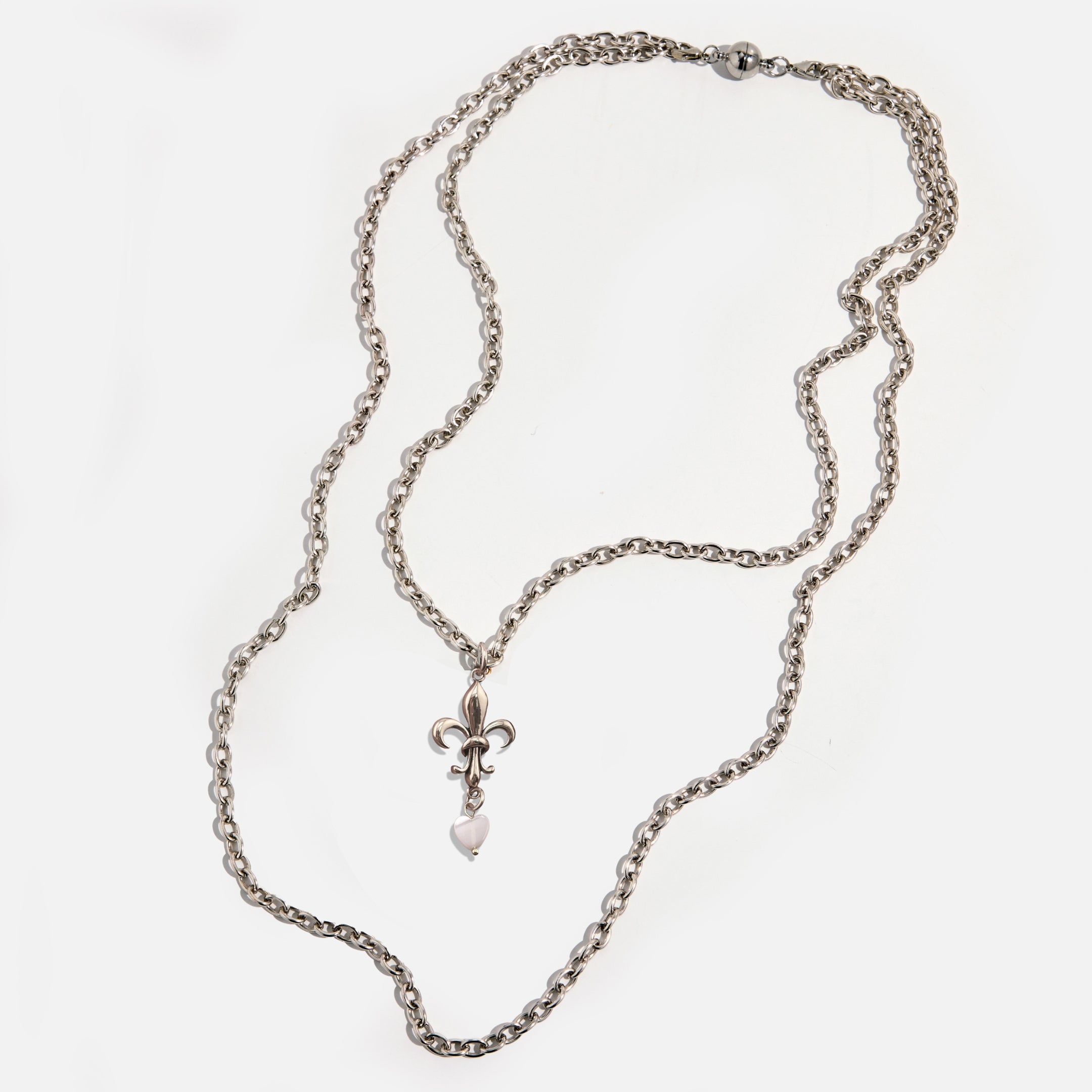 Katia Designs Love Fleur-de-Lis essential necklace in antique gold, featuring a detailed fleur-de-lis pendant on a chain.