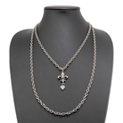 Katia Designs Love Fleur-de-Lis Essential Necklace in antique gold with a detailed fleur-de-lis pendant on a delicate chain