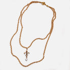 Katia Designs Love Fleur-de-Lis essential necklace in antique gold featuring a detailed fleur-de-lis pendant on a chain