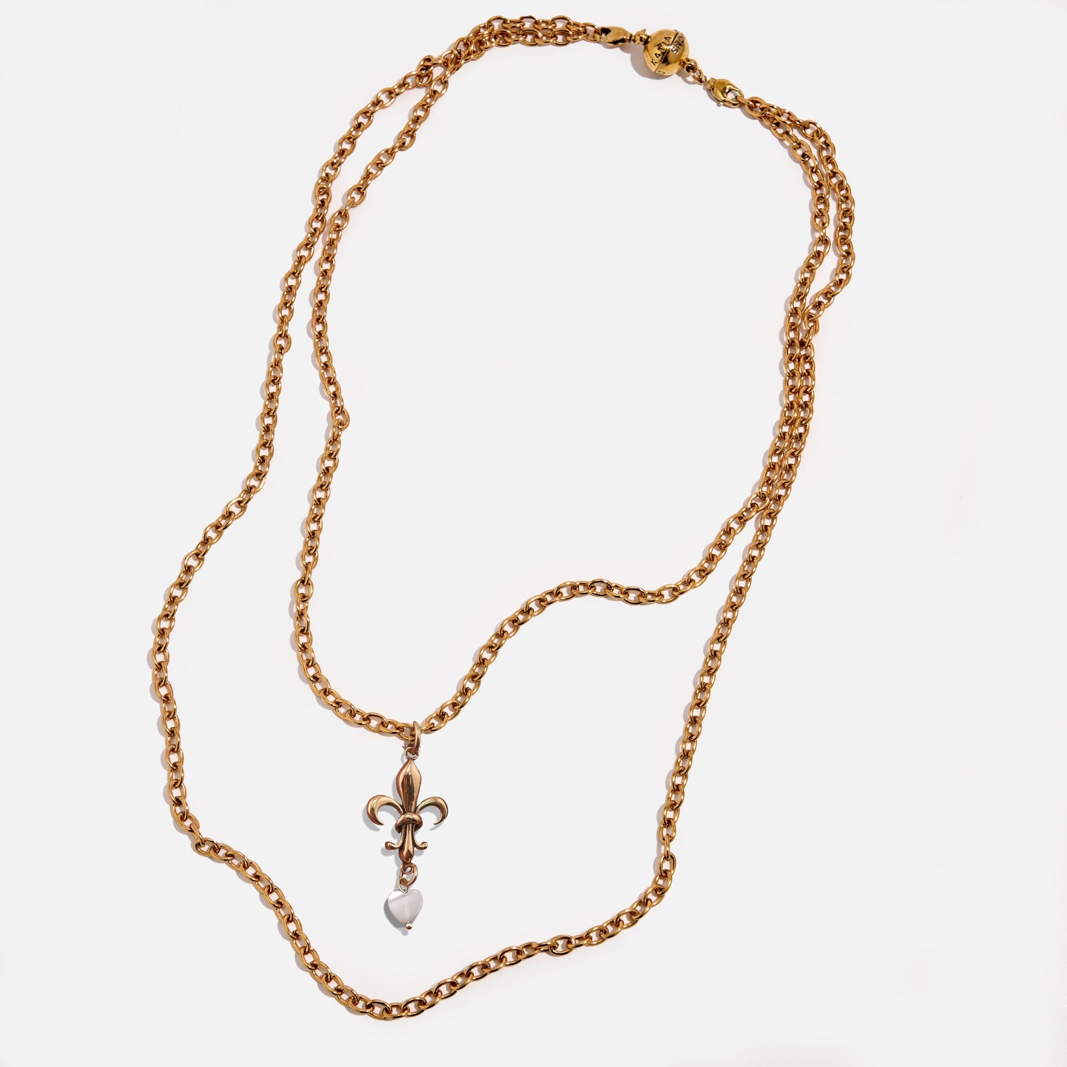 Katia Designs Love Fleur-de-Lis essential necklace in antique gold featuring a detailed fleur-de-lis pendant on a chain