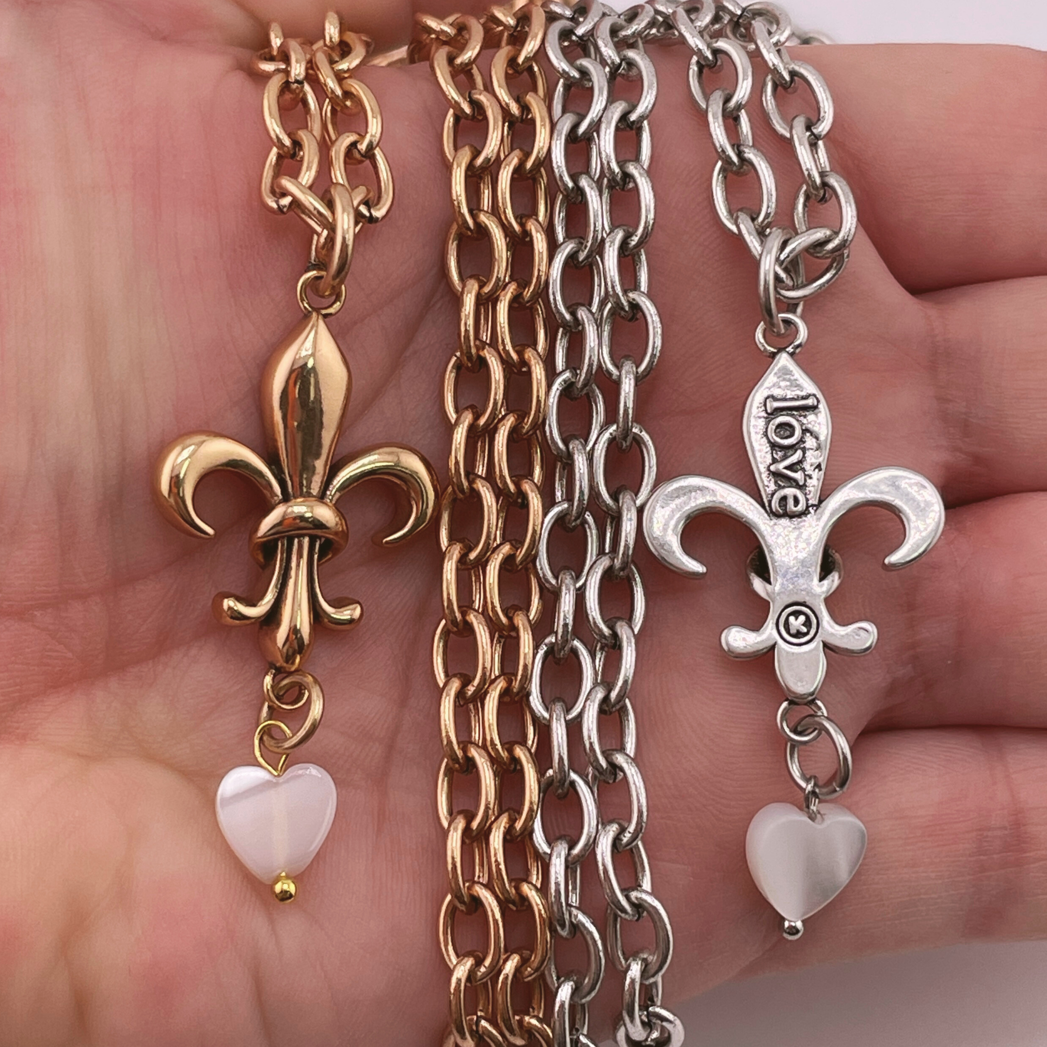 Katia Designs Love Fleur-de-Lis Essential Necklace in antique gold with intricate fleur-de-lis pendant and delicate chain.