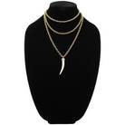 Katia Designs Love Tusk Essential Necklace in antique gold featuring a pendant with a love tusk design on a delicate chain