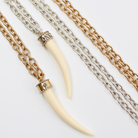 Katia Designs Love Tusk Essential Necklace in antique gold featuring a love-shaped tusk pendant on a delicate chain.