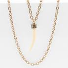 Katia Designs Love Tusk Essential Necklace in antique gold featuring a delicate tusk pendant on a fine chain.