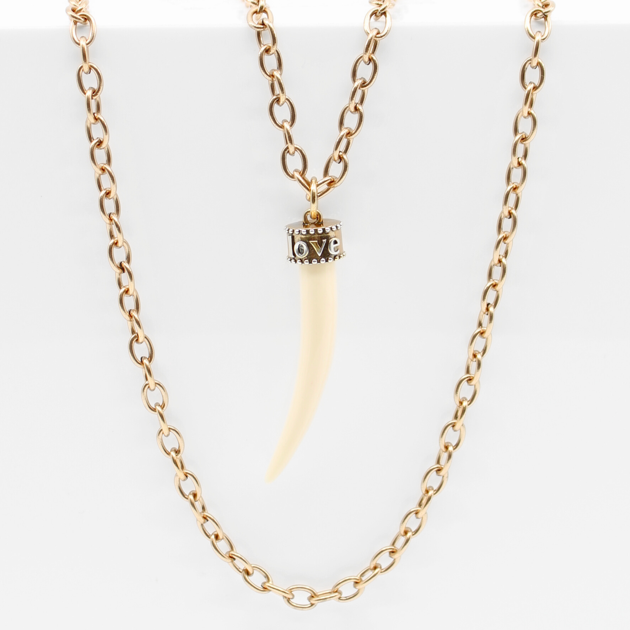 Katia Designs Love Tusk Essential Necklace in antique gold featuring a delicate tusk pendant on a fine chain.