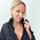 Katia Designs Love Tusk Essential Necklace in antique gold, featuring a delicate tusk pendant on a sleek chain.