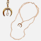 Katia Designs antique gold crescent moon klink necklace with intricate detailing and a delicate chain.