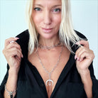 Katia Designs antique gold crescent moon klink necklace with intricate moon-shaped pendant on a delicate chain.