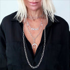 Katia Designs antique gold crescent moon klink necklace with engraved details, showcasing elegant moon pendant design.