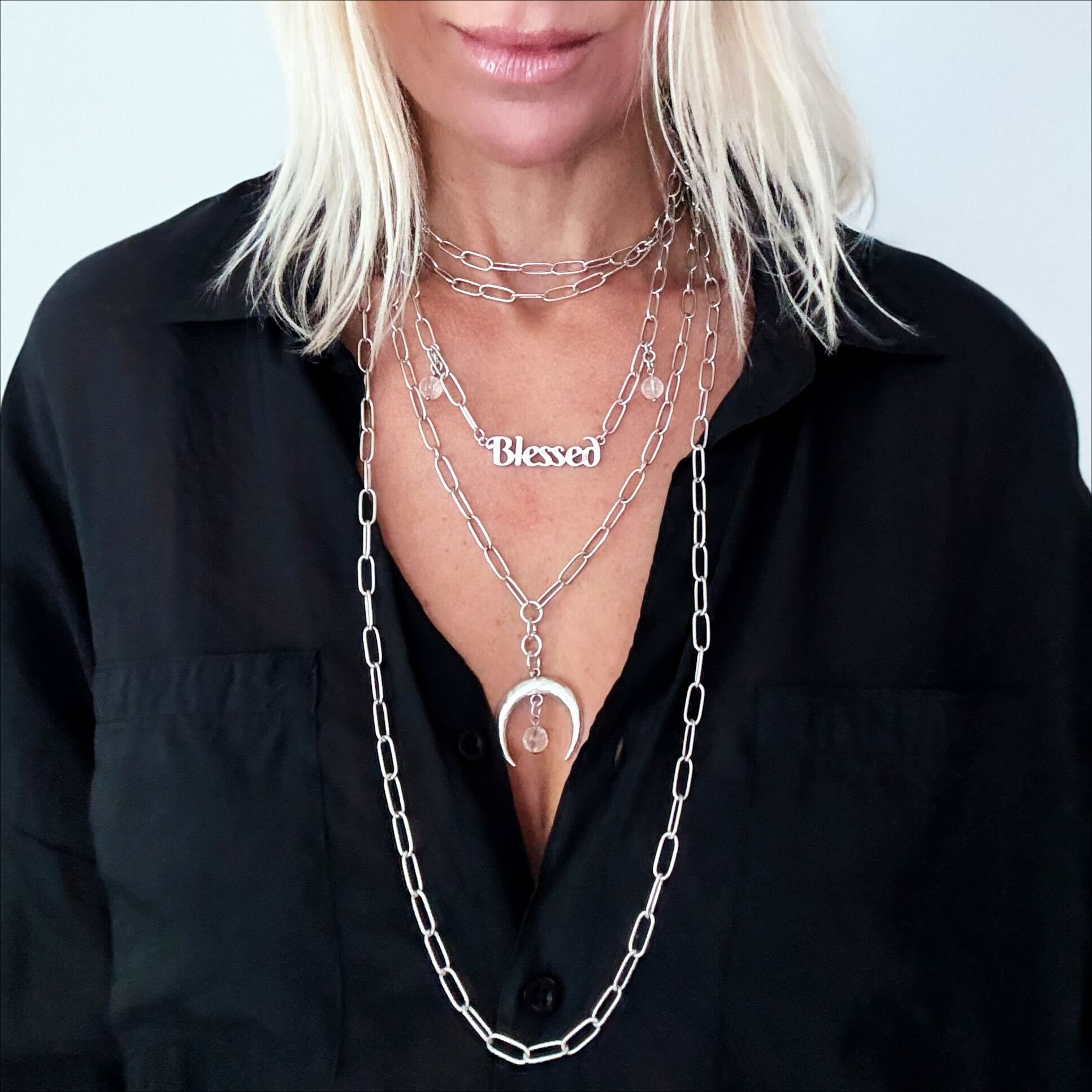 Katia Designs antique gold crescent moon klink necklace with engraved details, showcasing elegant moon pendant design.