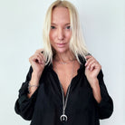 Katia Designs antique gold crescent moon klink necklace with intricate detailing, showcasing a celestial-inspired pendant.