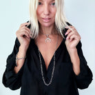 Katia Designs antique gold crescent moon klink necklace featuring a delicate, textured moon pendant on a fine chain.