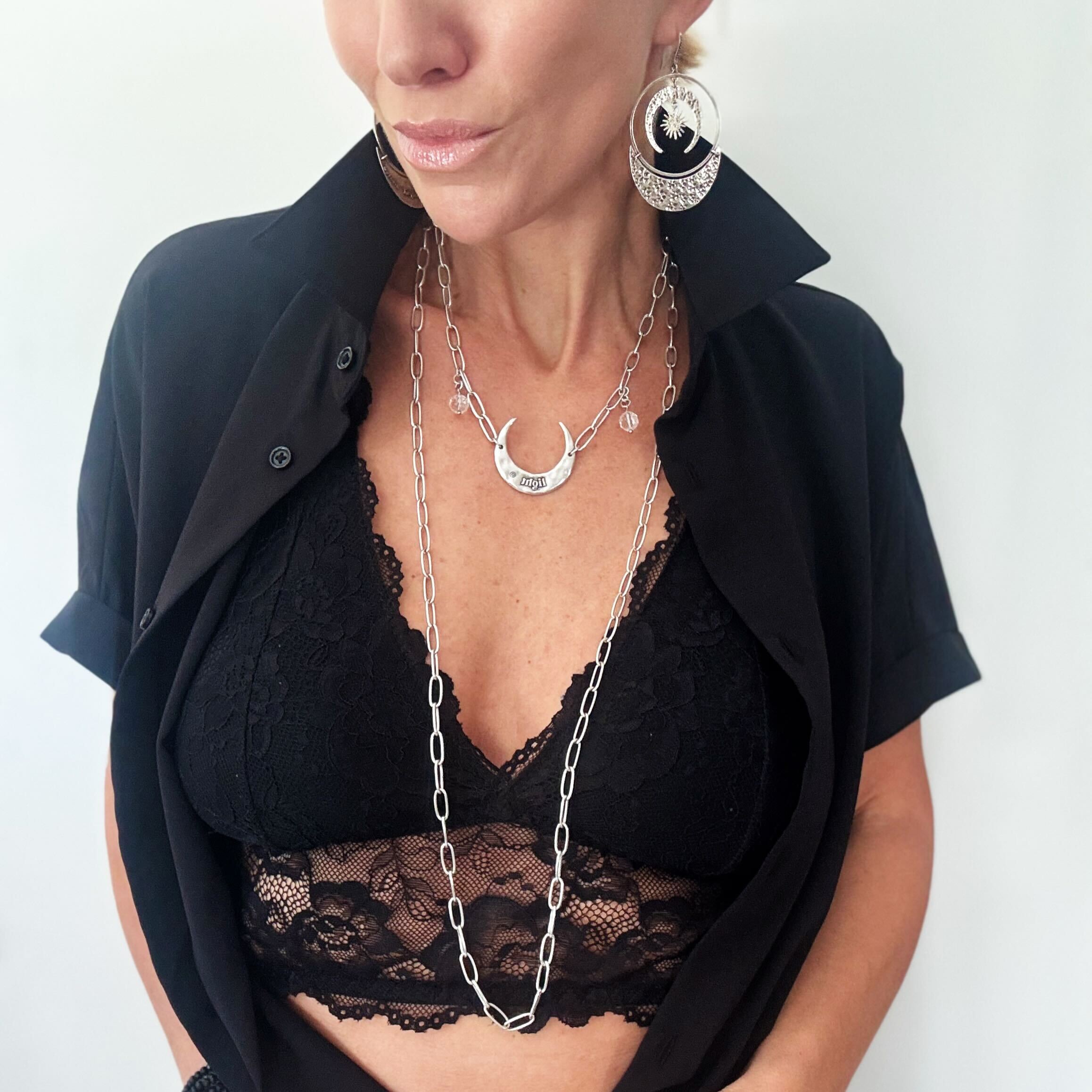 Katia Designs long chain necklace with antique gold crescent moon pendant, featuring a delicate and elegant jewelry design.