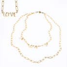 Katia Designs antique gold love long chain necklace with intricate link details, stylish and elegant jewelry accessory.