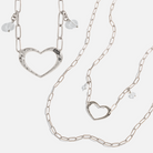 Katia Designs antique gold long chain necklace with open heart pendant, featuring a delicate and elegant jewelry design.