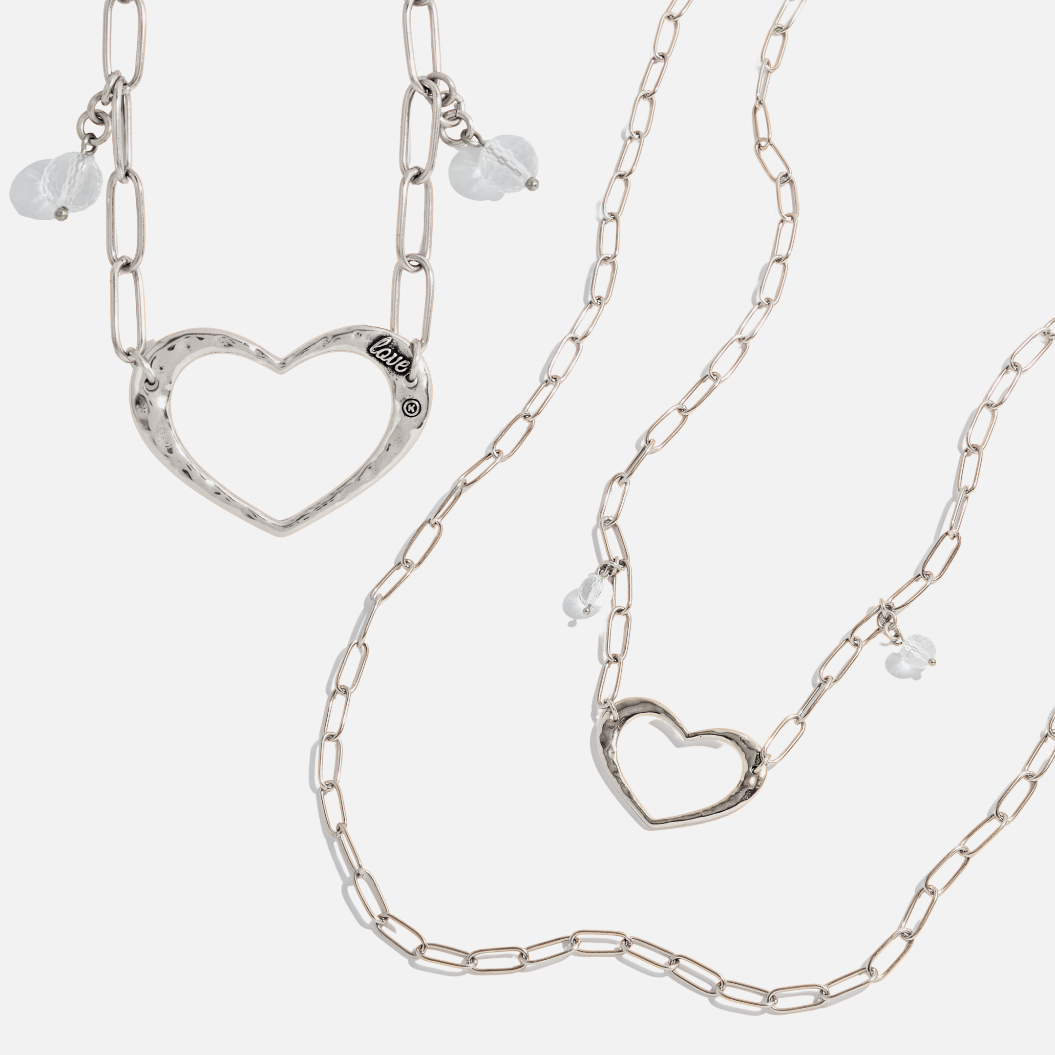 Katia Designs antique gold long chain necklace with open heart pendant, featuring a delicate and elegant jewelry design.