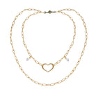 Katia Designs long chain necklace with an open heart pendant in antique gold, featuring a delicate and elegant design.