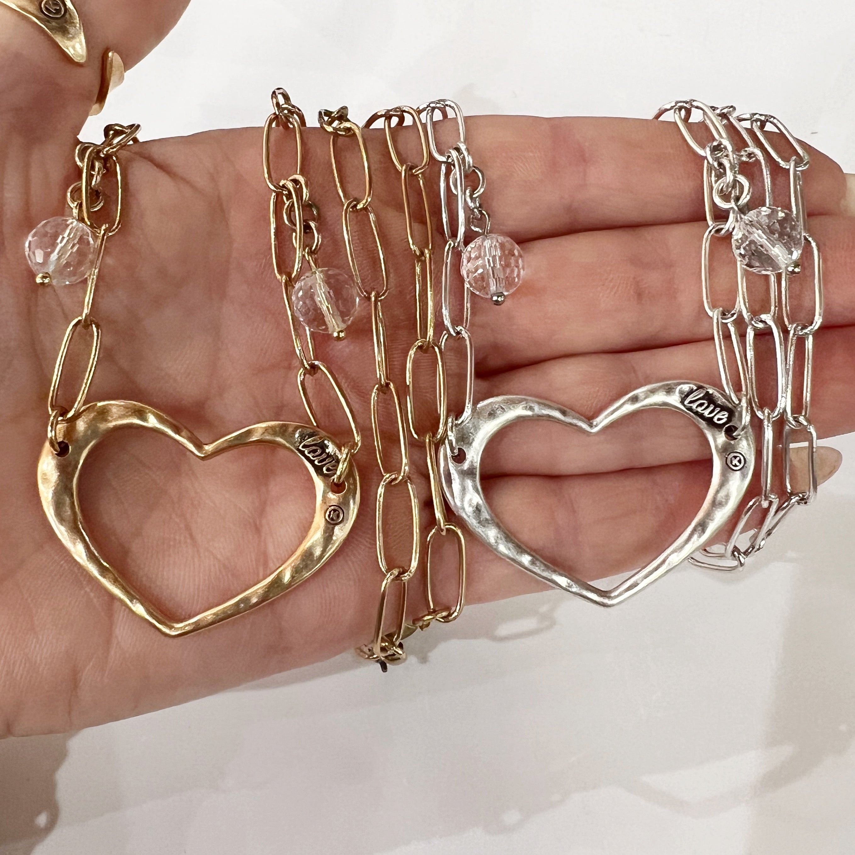 Katia Designs antique gold long chain necklace with open heart pendant, elegant jewelry for women.