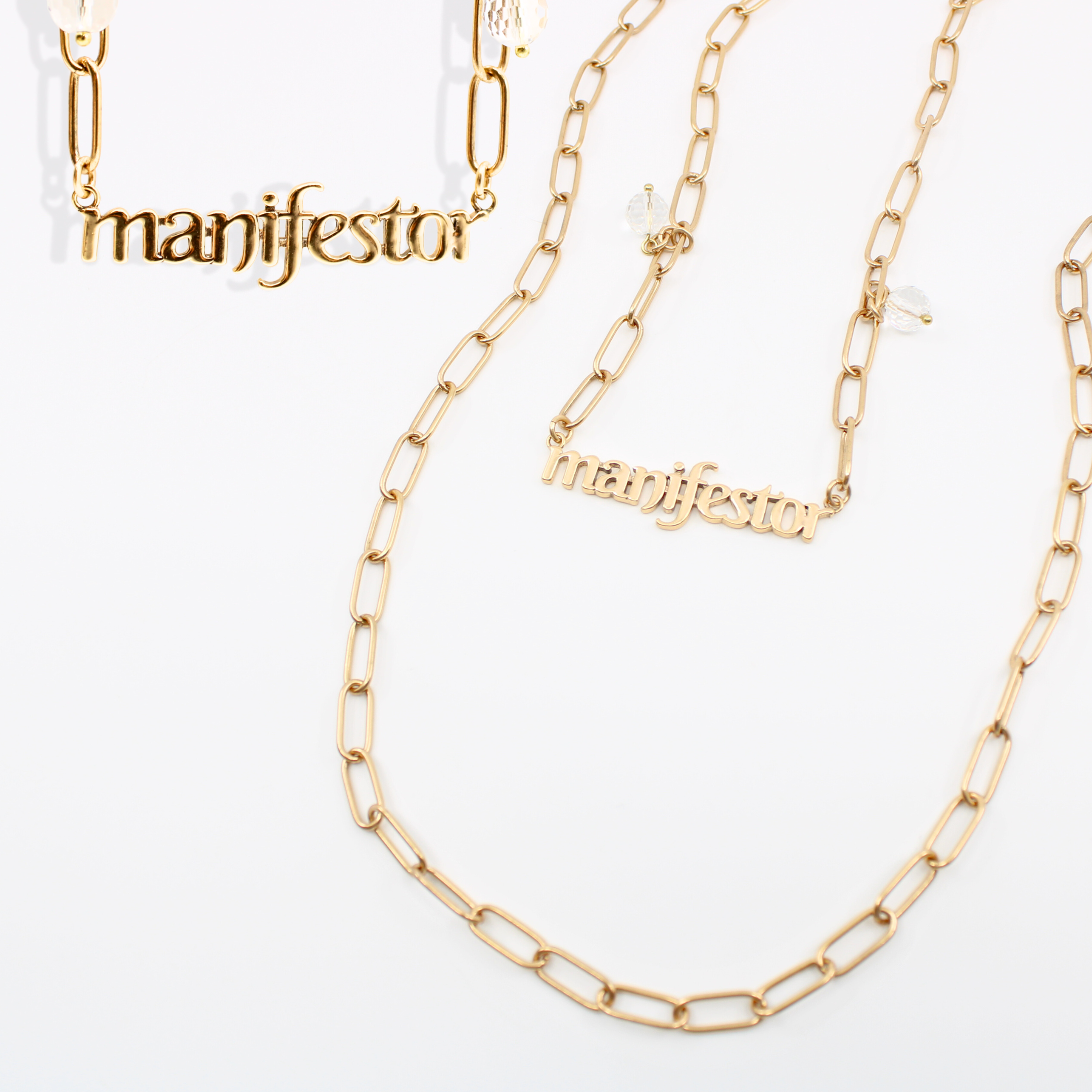 Katia Designs Manifestor long chain necklace in antique gold, featuring a stylish, elegant design with intricate detailing.