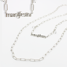 Katia Designs Manifestor long chain necklace in antique gold with intricate detailing and elegant design.
