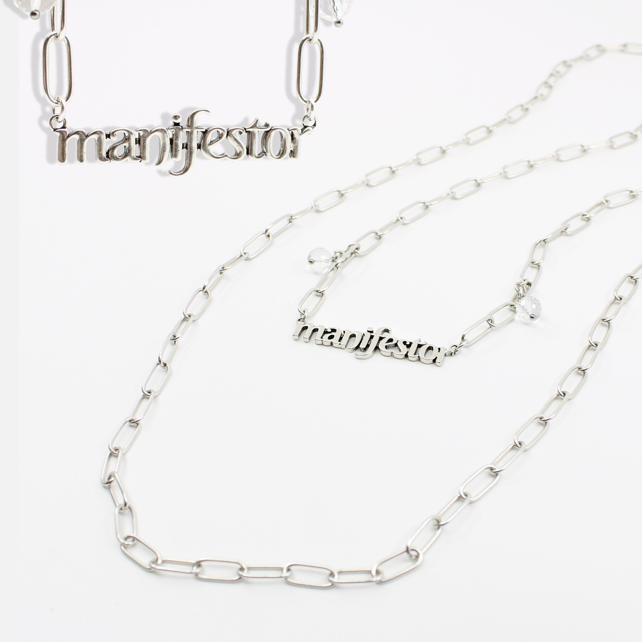 Katia Designs Manifestor long chain necklace in antique gold with intricate detailing and elegant design.