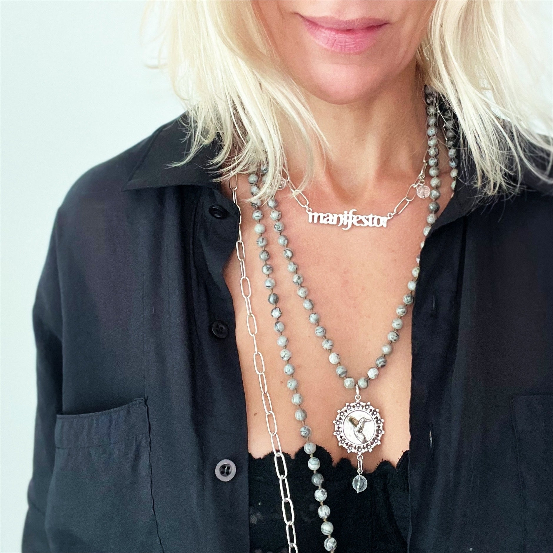 Katia Designs Manifestor long chain necklace in antique gold with intricate link details and elegant design.