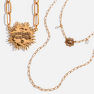 Katia Designs antique gold starburst long chain necklace with imperfect, handcrafted design, featuring a delicate, elongated chain.