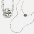 Katia Designs antique gold starburst long chain necklace with imperfect, handcrafted design, featuring a delicate pendant.