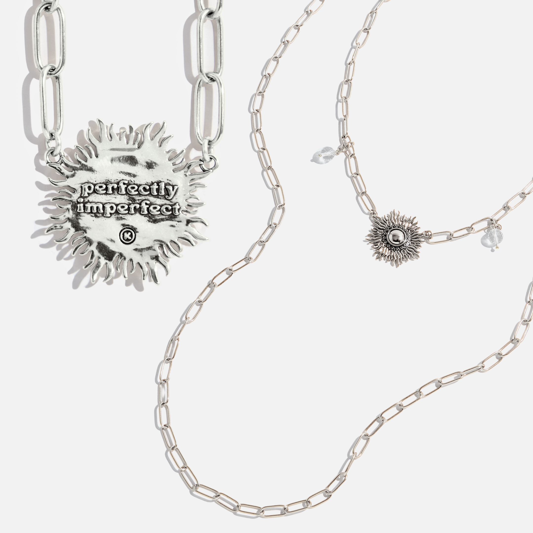 Katia Designs antique gold starburst long chain necklace with imperfect, handcrafted design, featuring a delicate pendant.