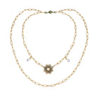 Katia Designs antique gold starburst long chain necklace with imperfect, handcrafted design and intricate starburst pendant.