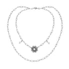 Katia Designs antique gold starburst long chain necklace with imperfect, unique pendant design on a model.