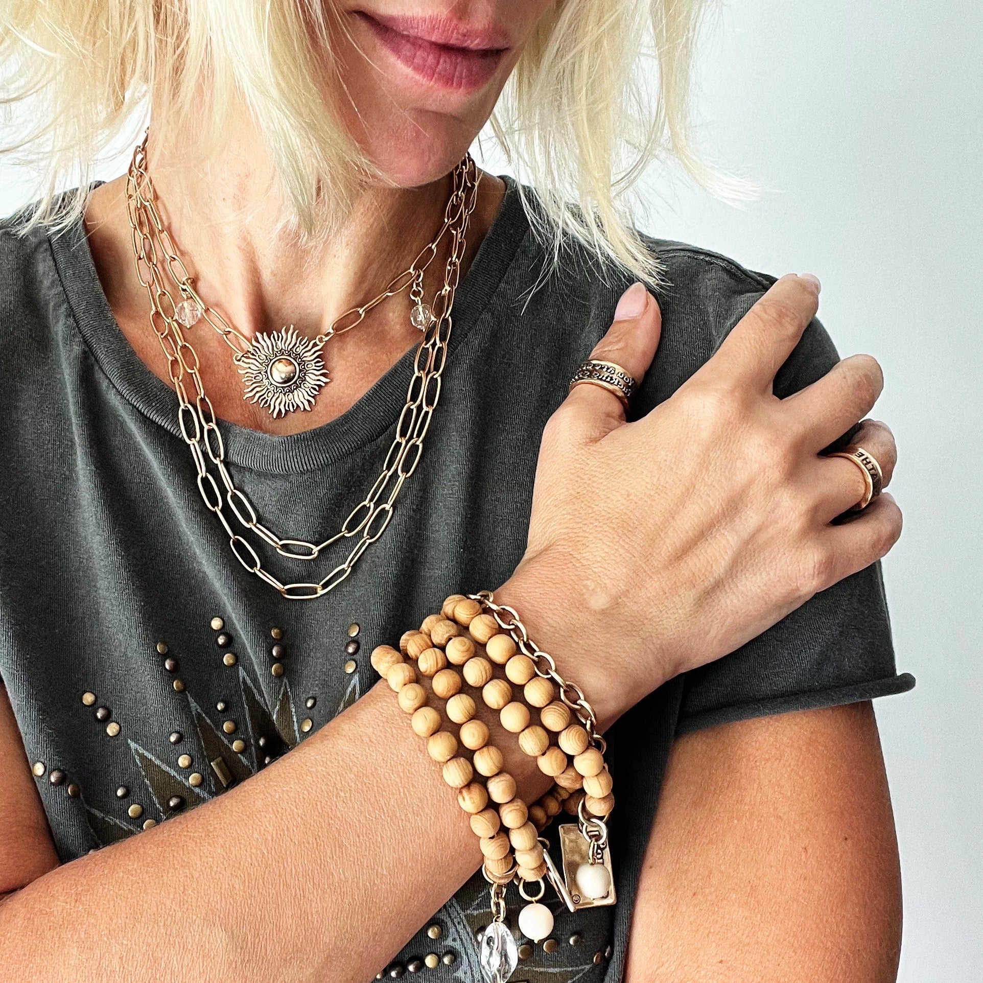 Katia Designs antique gold starburst long chain necklace with imperfect, handcrafted design and intricate detailing.