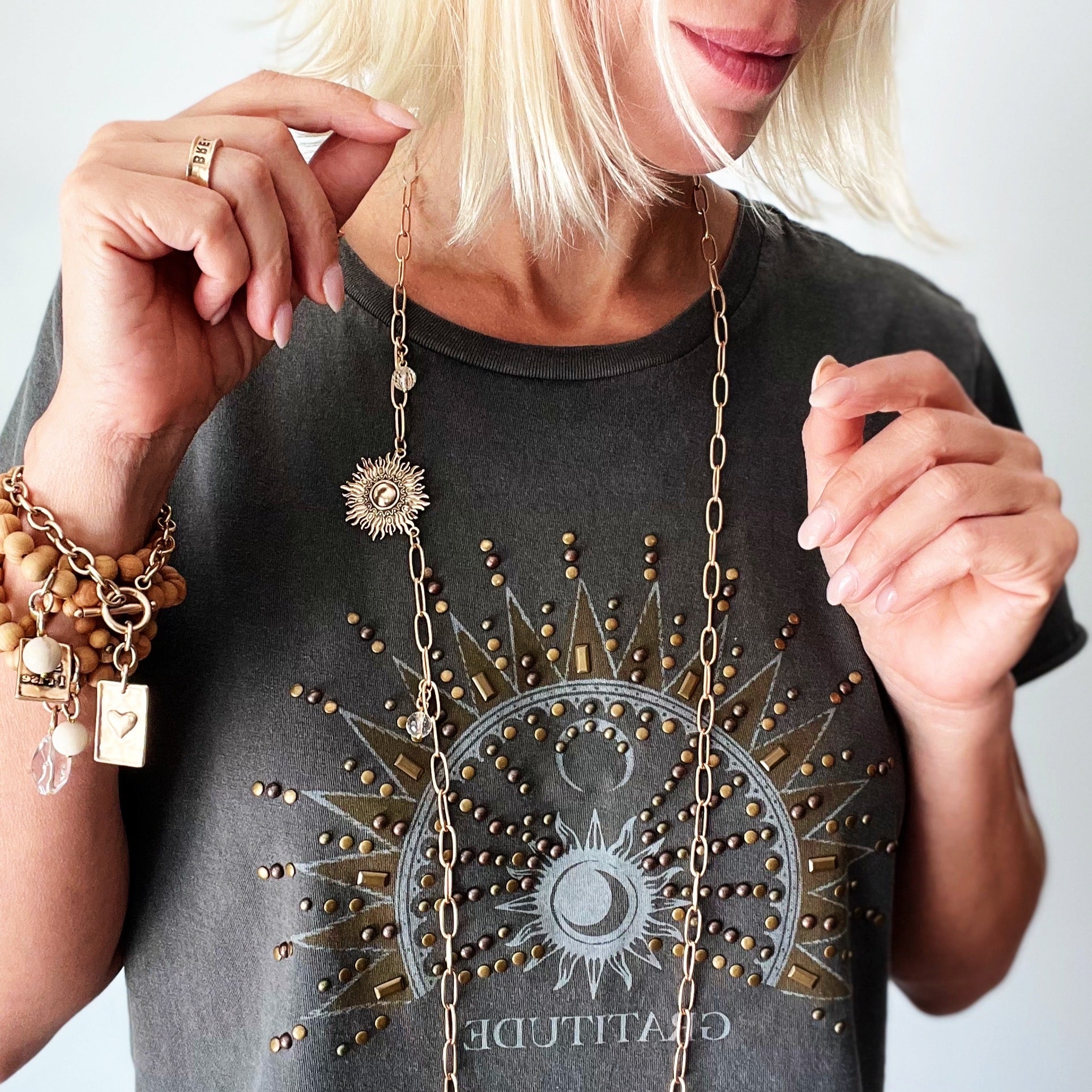 Katia Designs antique gold starburst long chain necklace with imperfect, artistic detailing, stylish accessory for casual or formal wear.