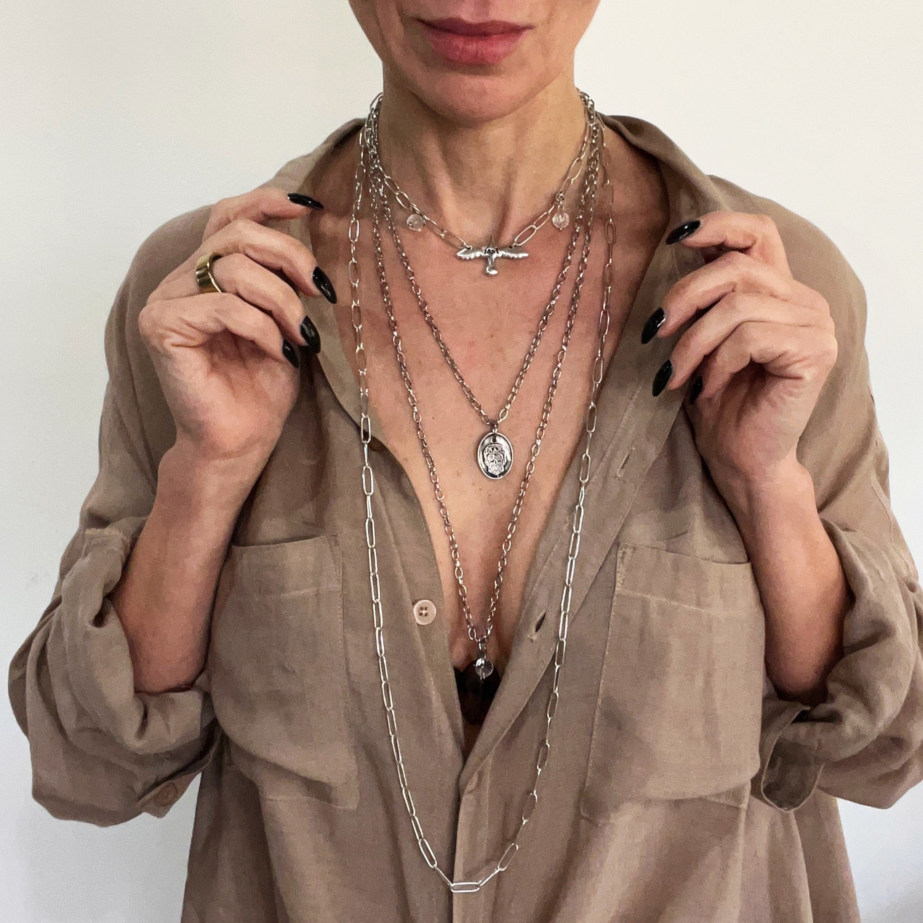 Katia Designs I Am Bird long silver chain necklace featuring a delicate bird pendant on a extended chain.