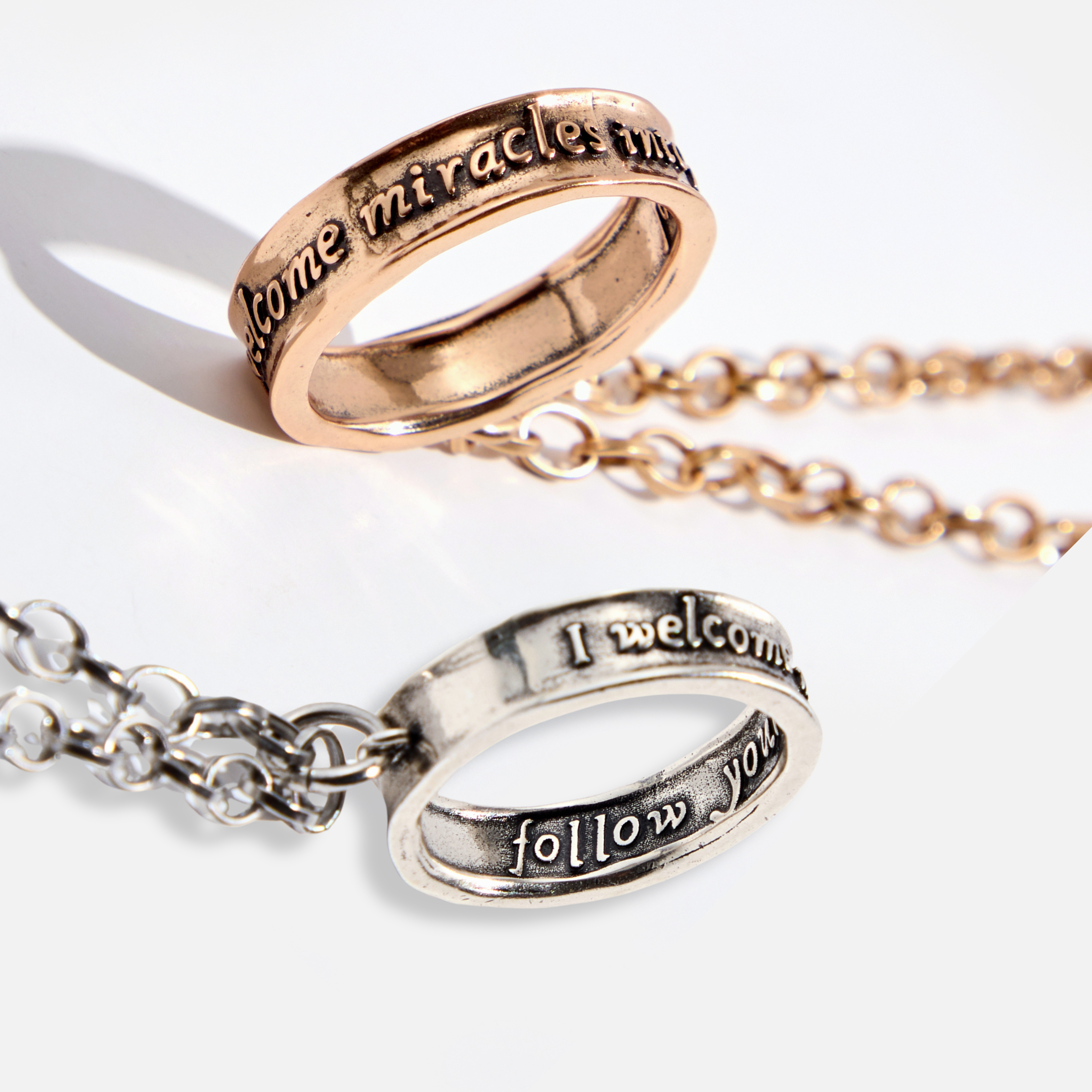 Katia Designs original antique gold necklace with clear AB crystals, featuring the "I Welcome Miracles" ring pendant.
