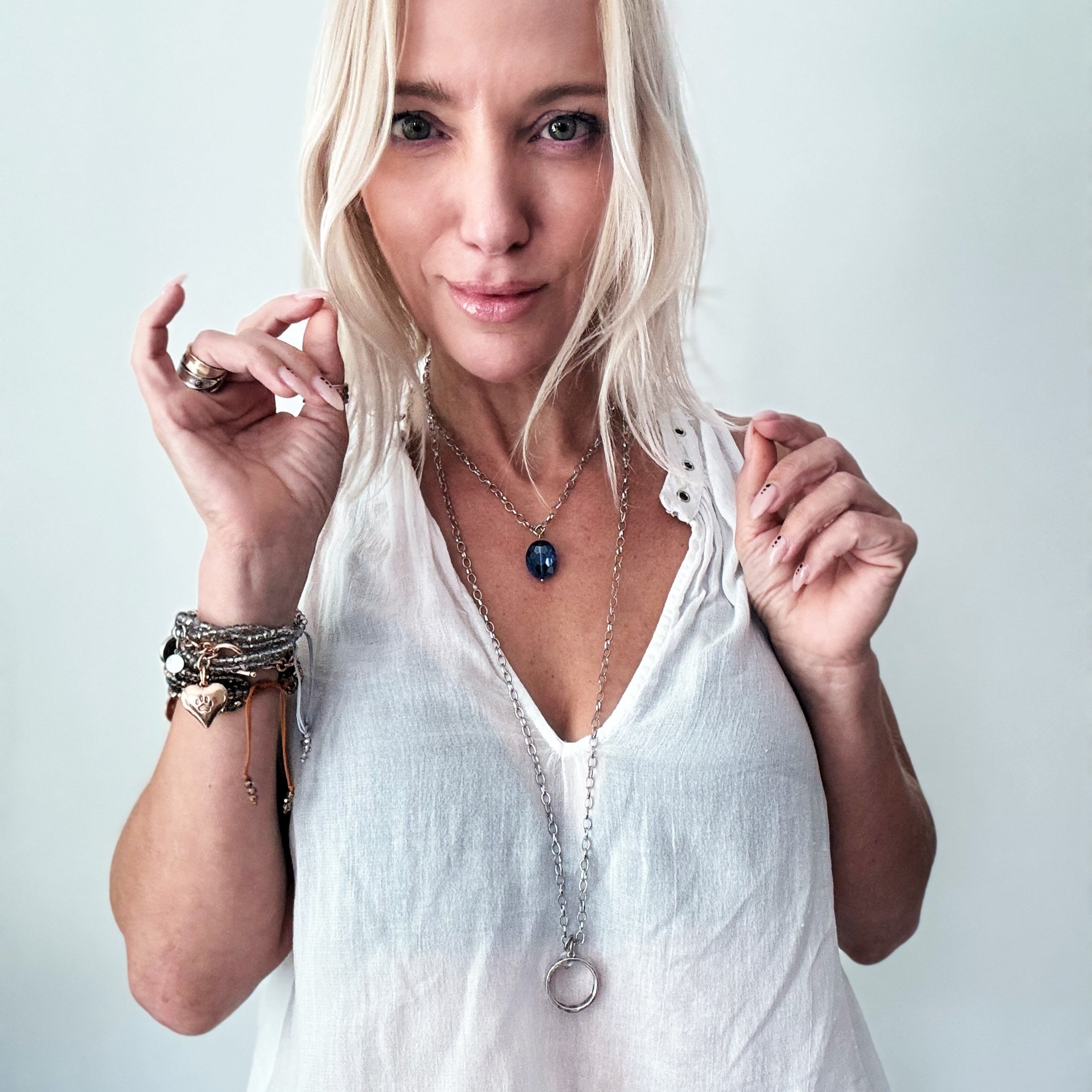 Katia Designs I Welcome Miracles ring necklace in antique gold with clear AB crystals, featuring a delicate pendant design.