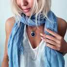 Katia Designs I Welcome Miracles necklace featuring an antique gold finish with a clear AB crystal accent and ring pendant.