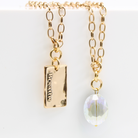 Katia Designs Breathe Original Lite Necklace in antique gold with aqua quartz pendant, delicate chain, and elegant design.