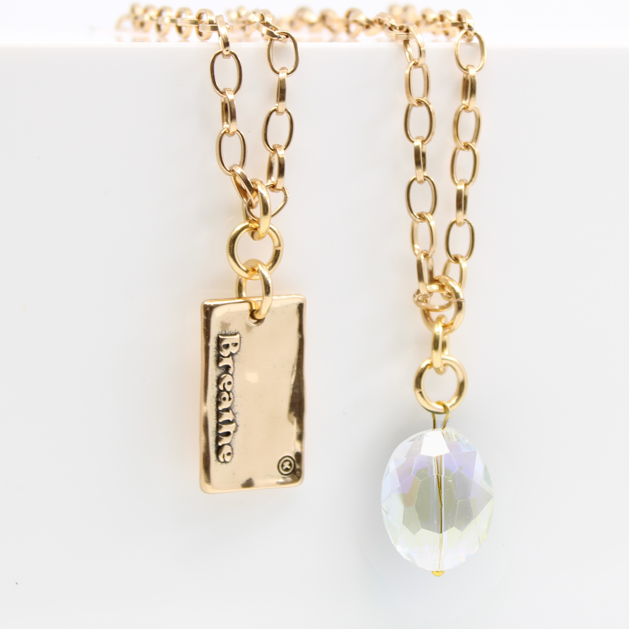 Katia Designs Breathe Original Lite Necklace in antique gold with aqua quartz pendant, delicate chain, and elegant design.
