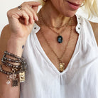 Katia Designs Breathe Original Lite Necklace with antique gold finish and aqua quartz pendant, delicate and stylish jewelry piece.