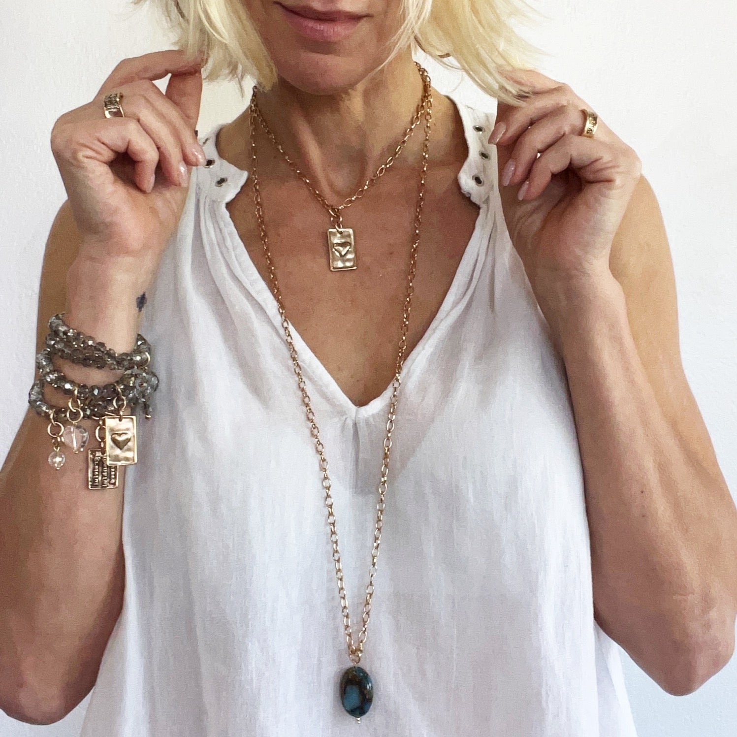 Katia Designs Breathe Original Lite Necklace with antique gold finish and aqua quartz pendant, delicate and stylish jewelry piece.