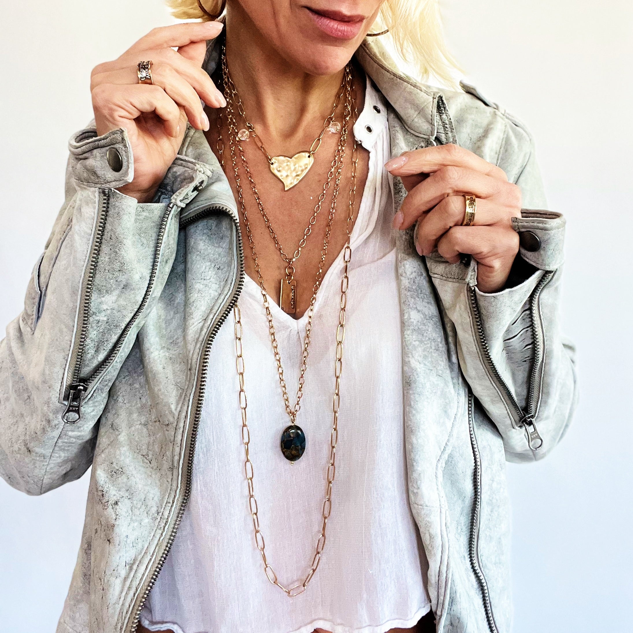 Katia Designs Breathe Original Lite Necklace with antique gold finish and aqua quartz pendant, featuring delicate chain and elegant design.