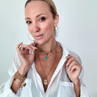 Katia Designs Remember Who the F*ck You Are Original Lite Necklace with antique gold finish and a clover pendant.