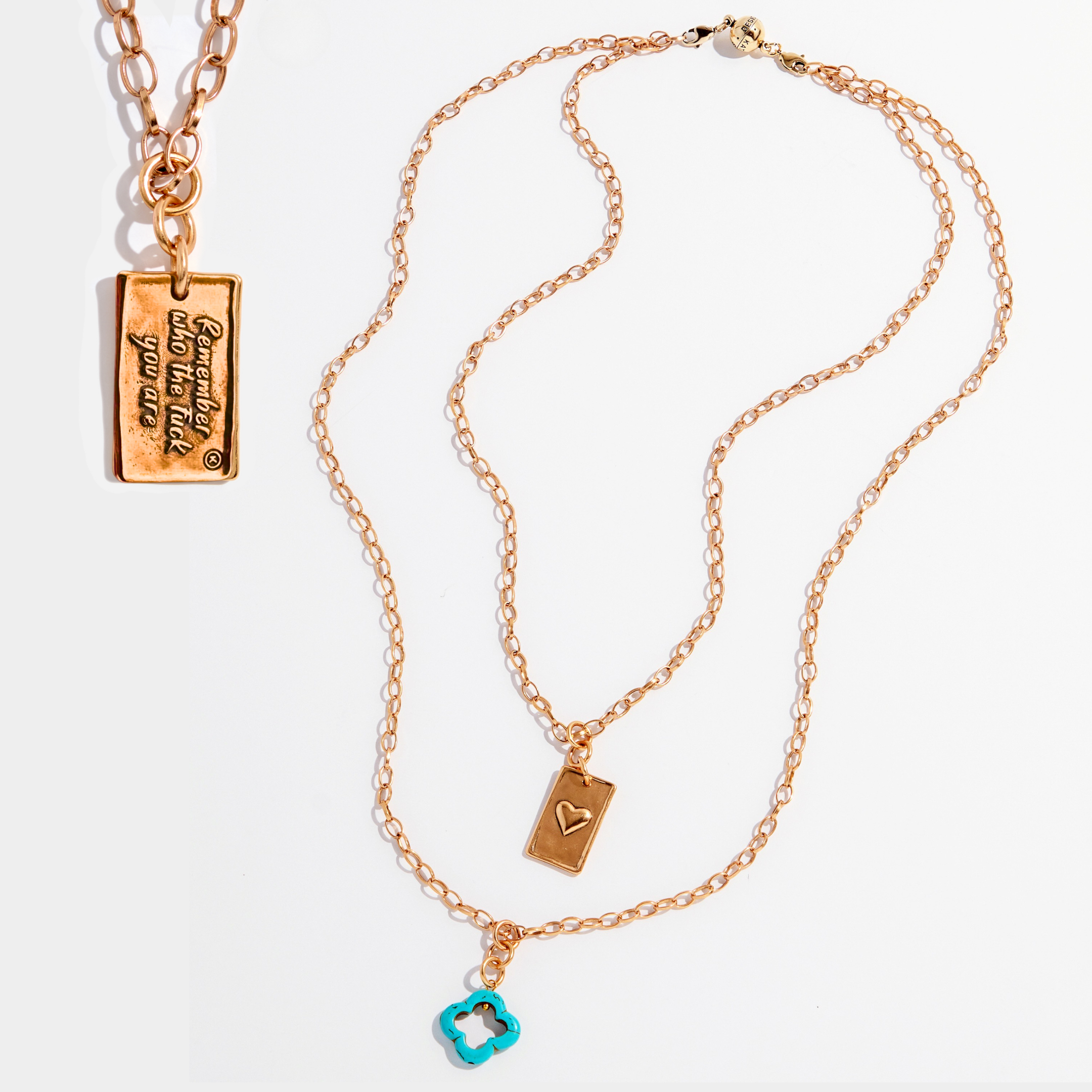 Katia Designs original Lite antique gold necklace with a clover and engraved "Remember Who the F*ck You Are" pendant.