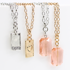 Katia Designs Love Heart Original Lite Necklace in antique gold, featuring a delicate heart pendant on a fine chain.