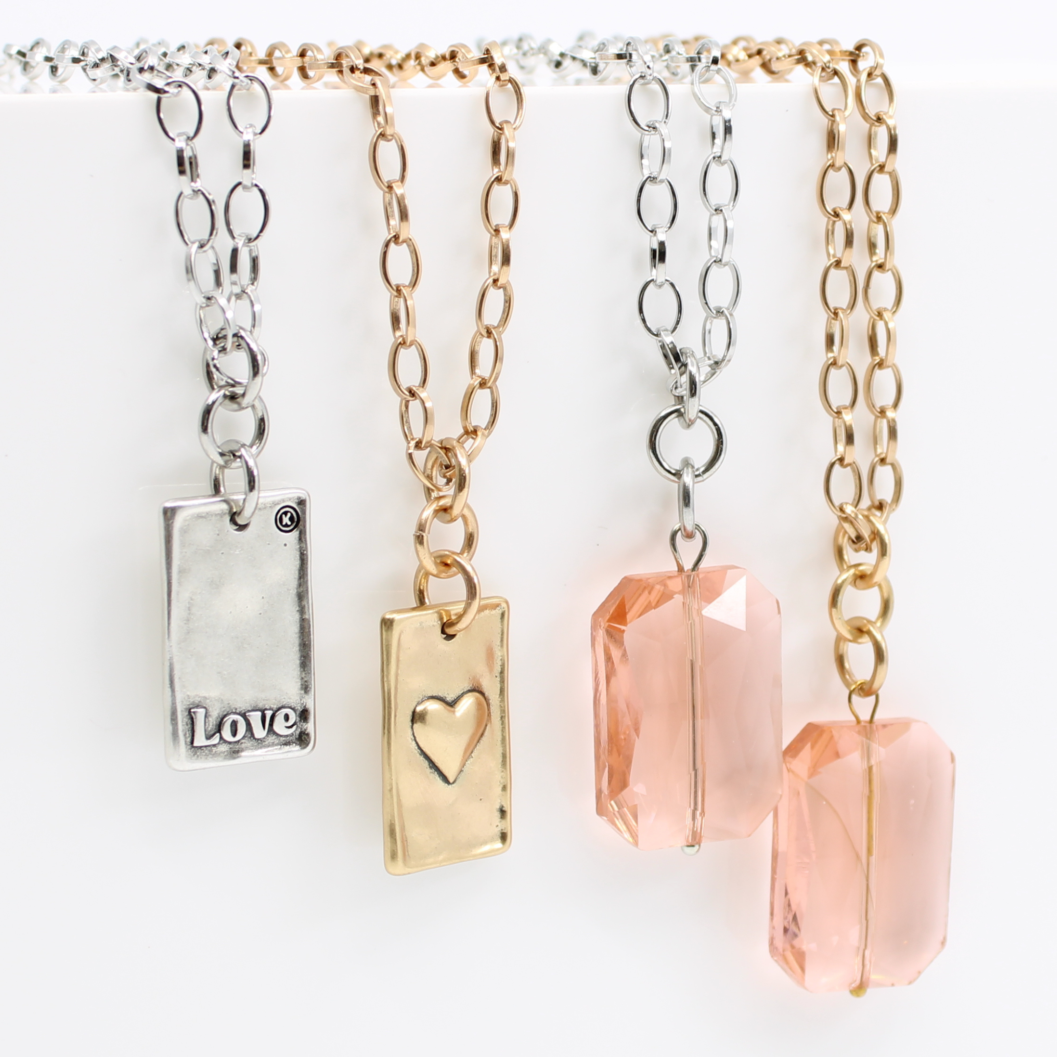Katia Designs Love Heart Original Lite Necklace in antique gold, featuring a delicate heart pendant on a fine chain.