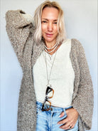 Katia Designs Peace & Love Star and Bird Original Lite Necklace in antique gold, featuring a star and bird pendant design.
